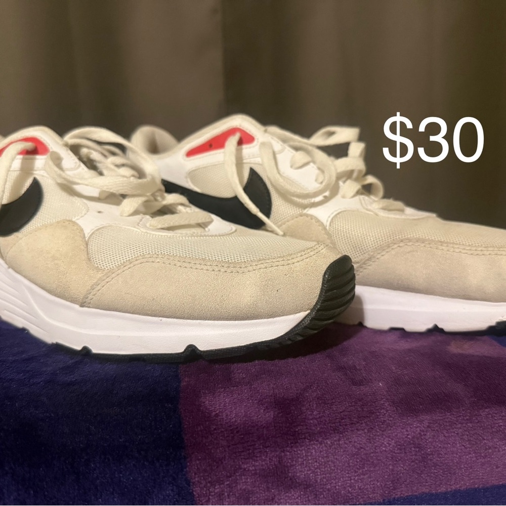 Cream and Black Nike Sneakers.